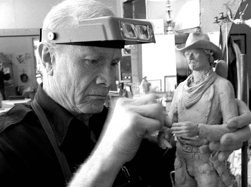 Michael Garman sculpts one of his many characters.
Courtesy of Michael Garman Productions
