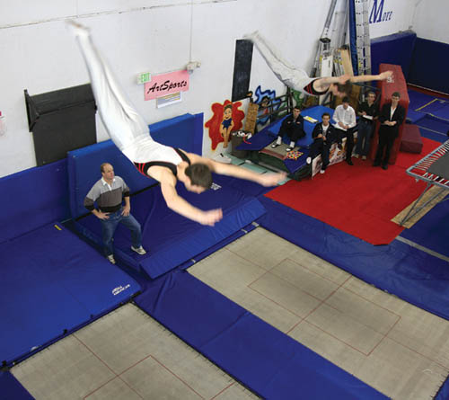 Synchronized trampolinists Tim Rohlfing (left) and Philip Gifford perform during an ArtSports event Feb. 9 that also 
featured potential Olympics qualifier Logan Dooley.
Westside Pioneer photo