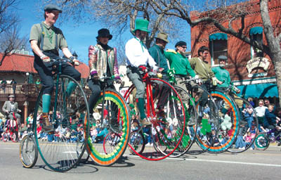 The Rocky Mountain High Wheelers form a line.