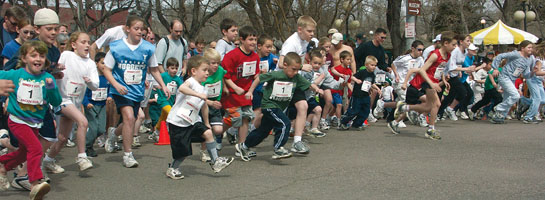 Youngsters dash from the starting line in the Kids Fun Run 
on Colorado Avenue prior to the St. Patrick's Day Parade March 13.