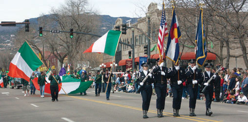 The Colorado Springs Police Honor Guard and Irish flags leading the parade from 27th Street.