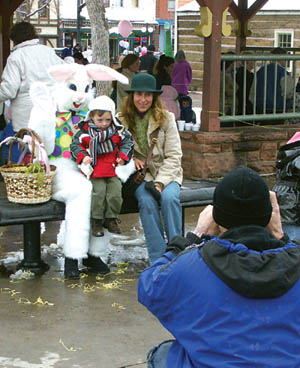 Maria Goni and son, Roman, have their pictures taken with the Easter Bunny.