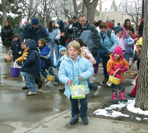 Youngsters look sharply for eggs at the start of the ages 5-to-8 Easter Egg Hunt. 