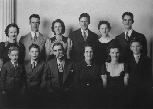 A photo taken in 1942, just before young Fred went into the service, also shows his parents and siblings. Back row (from 
left): Ila, Delbert, Edna, Ed, Alma and Fred Jr. Front row (from left): Tilman, Ray, Fred Sr., his wife Lilley, Twila (she and Ray were twins) and Cleo.
Courtesy of Fred Bishop