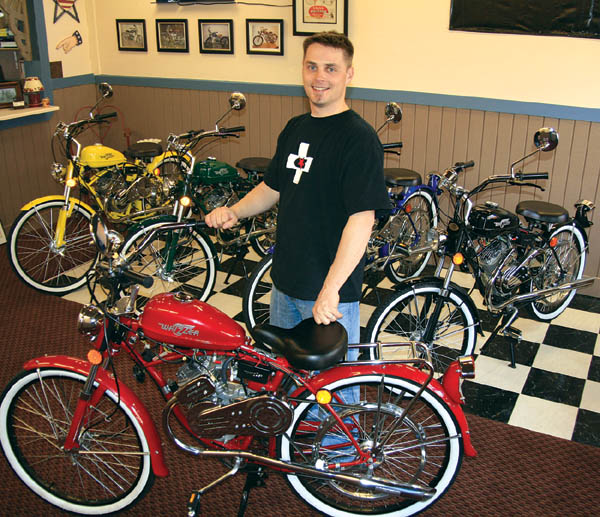 Dallas Maddox displays the five colors of Whizzer motorbikes inside his Old Colorado City showroom.
Westside Pioneer photo