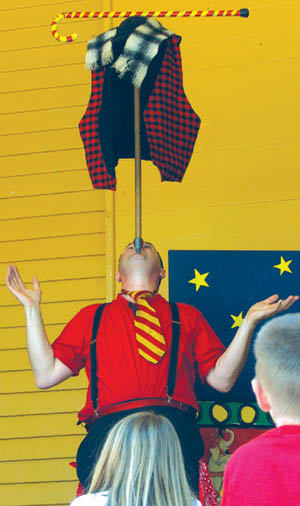 Jim Jackson demonstrated a unique way to put on a vest,
scarf and cane during a Manitou Art Theater outreach show
in Bancroft Park two years ago.
Westside Pioneer file photo