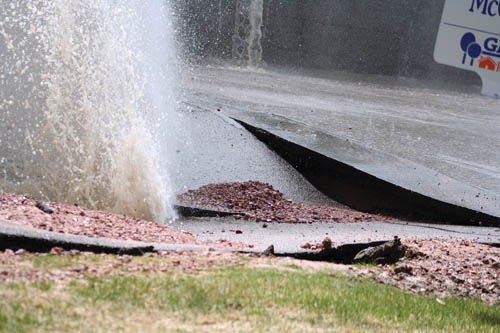 Close-up of the pavement buckling where the water forced its way through the ground from a broken water line on 
Vondelpark Drive May 3.
Katie Queen photo