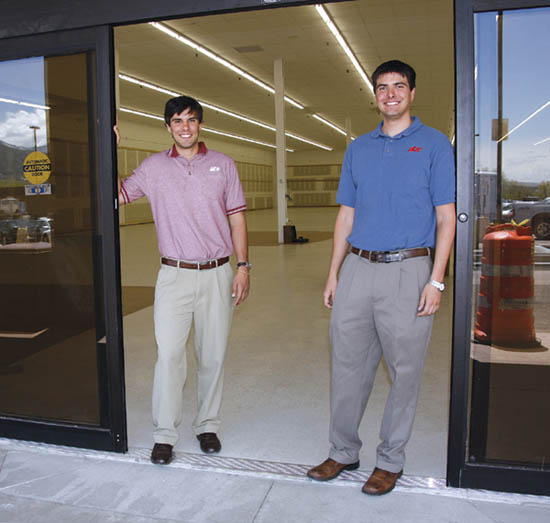 With the remodeled, currently empty store space behind
them, Nick (left) and Kirby Kuklenski stand next to the new
sliding glass door that will ease entry to their new Ace Hardware at the Uintah Gardens shopping center.
Westside Pioneer photo