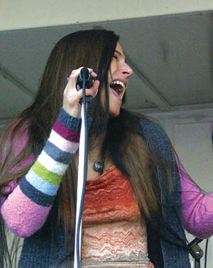 lead singer Diana Mangano enjoys a song