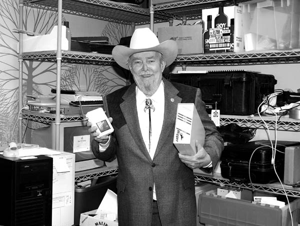 Dave Hughes displays a couple of telecommunications devices.
Westside Pioneer file photo