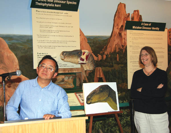 Dr. Kenneth Carpenter and Kathleen Brill of the Denver
Museum of Nature & Science answer questions about 
Theiophytalia kerri during a press conference May 24 at the
Garden of the Gods Visitor & Nature Center. The foreground picture is Carpenters rendering of the new dinosaur genus/species.
Westside Pioneer photo