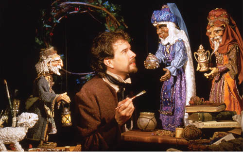 Puppeteer David Simpich is shown putting the finishing touches on dolls he made for one of his shows.
Courtesy of David Simpich