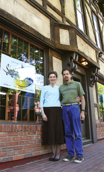 David and Debby Simpich stand by a sign advertising the
coming of the Simpich Showcase outside the former
Simpich Character Dolls business, 2413 W. Colorado Ave. The couple plans to renovate the site  made famous by Davids parents  for a new enterprise featuring 
an art gallery, Simpich doll museum and his marionette theater.
Westside Pioneer photo
