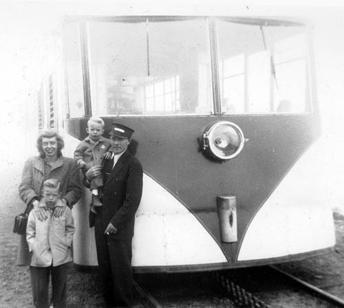 Around 1950, holding younger son Jerry while standing
beside a Cog Railway train on which he was a conductor,
Everett Decker is joined by his wife Lorene and older son Ron.
Courtesy of Ron Decker