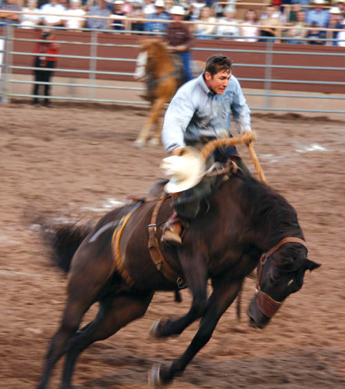 Dustin Weist hangs on in the Bronc Riding competition during the 2007 Ride for the Brand Rodeo at the Norris-Penrose 
Event Center. The working cowboys rodeo will be July 5 this year, followed by Pikes Peak or Bust July 9-12.
Westside Pioneer file photo