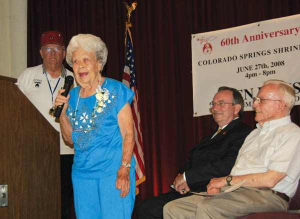 One-time Arensdale School student Crystal Rhodes recalls
some history during the Colorado Springs Shrine Clubs 60th
anniversary celebration June 27 on the stage at the club
(and former Arensdale site). Listening are (from left) club
President Richard Hanson, Colorado Springs Vice Mayor Larry Small and Gene Current (also a former Arensdale student).
Westside Pioneer photo