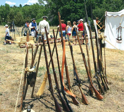 Revolutionary War-era rifles (foreground) and cannons
(rear) were on display at Rock Ledge as part of an encampment for the event.
Westside Pioneer photo