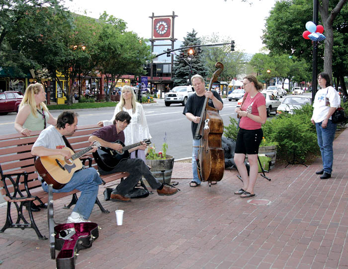 With the 25th and Colorado clock tower in the background,
The Happenstance band performs during the merchants Magic in Old Colorado City promotional event July 5.
Westside Pioneer photo