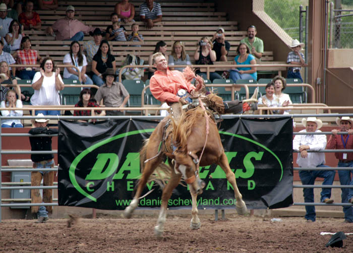 Owen Hiatt of the local T-Cross Ranches & Norris Cattle Co.
rides to victory in the bronc riding competion of the Ride for the Brand Rodeo July 5.
Westside Pioneer photo