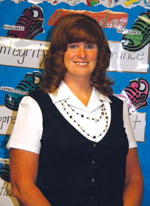 New Midland Elementary Principal Robyn Colbert stands in front of a chart in a classroom listing different points 
related to the Westside schools International Baccalaureate program.
Westside Pioneer photo