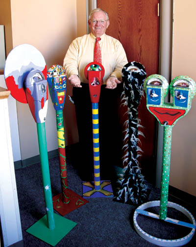 City Council member Jerry Heimlicher displays the first 5 of
what he hopes will eventually be 100 custom-decorated
parking meters at indoor locations around town to collect coin donations for a program intended to reduce the numbers of hardcore homeless people. 
Westside Pioneer photo