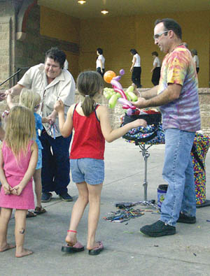 Balloon twister Gary Jones was a busy man. Line dancers perform on stage.
Westside Pioneer photo