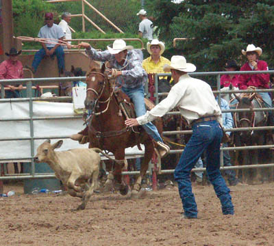 Cody Gerard of Eagle rides in hot pursuit during the senior
boys calf roping competition during the National Little Britches Finals Rodeo championship round July 31. He finished eighth.