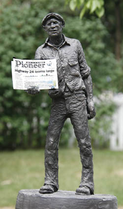 The Newsman, a 1977 Michael Garman sculpture, hawks a current Westside publication. 
Westside Pioneer photo