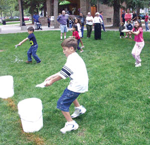 Children try to keep from spilling during a water race in the broomstick rodeo.
Westside Pioneer photo