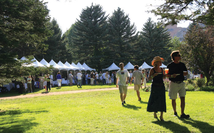 Attendees at Rock Ledge Ranchs Fiddles, Vittles and Vino
stroll among the food and drink tents on the lawn west of the Orchard House.
Westside Pioneer photo