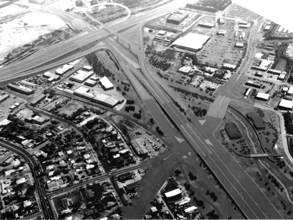 A rendering from the Colorado Department of
Transportation (CDOT) shows what an expanded Highway
24 could look like from the air. The view is east, toward a
new I-25/Cimarron interchange (including
eastbound-to-northbound flyover thats an option on
current CDOT plans), with an also-new Eighth Street
interchange in the foreground. Removed to make room for
the larger asphalt swath are all the current commercial uses
on the south side of that interesection. A possible
replacement shopping center is shown  at the southwest corner.
Courtesy of CDOT 