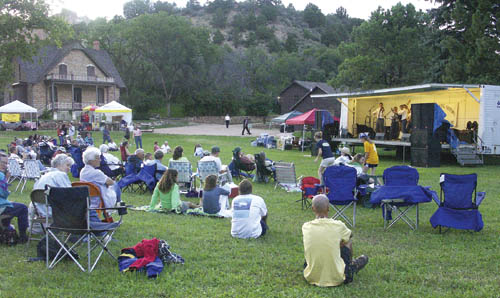 Festival-goers take in the Stanleytones at the main stage in
the early evening. At left in background is the Rock Ledge House. 
Westside Pioneer photo
