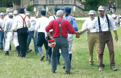 Andy Morris (far right), Rock Ledge Ranch Historic Site
manager and player/coach of the Camp Creek
Cloudbusters, joins teammates in shaking hands with
players from the Denver Territorial All-Stars Sept. 5
just after winning for the first time in the annual Labor
Day old-time baseball game at the ranch.
Westside Pioneer photo