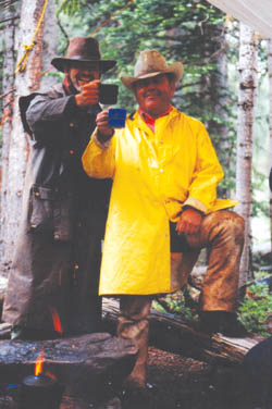 Tom Stephenson (right) enjoys a drink with a Sangre de Cristo Mountain area ranch owner in 2001.