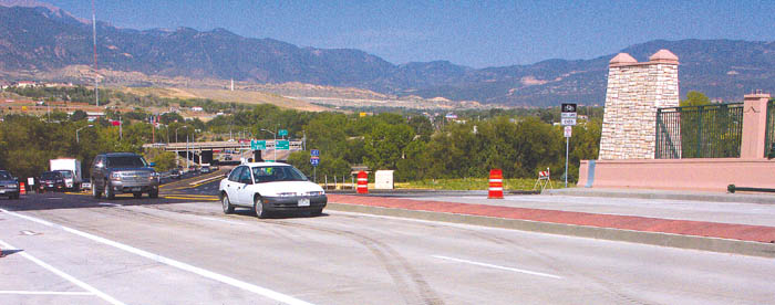 Vehicles roll over the new Cimarron bridge, filling both eastbound lanes. The bridge over Conejos Street and the 
railroad tracks has reopened with two lanes each way, plus bike lanes and sidewalks.
Westside Pioneer photo