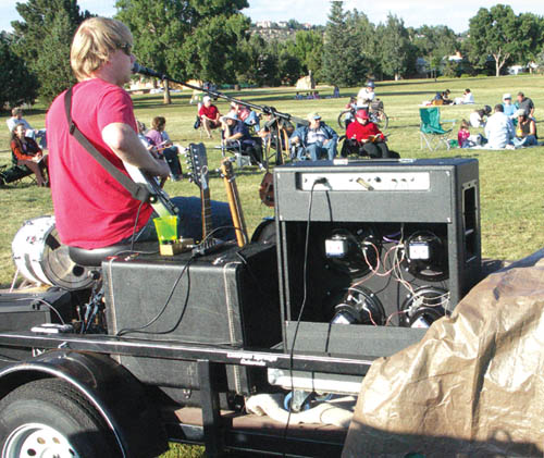 Some listen, some relax and some get neighborly during one-man blues band John-Alex Masons performance Sept.
6 in Jackson Park. His stage was a borrowed motorcycle trailer, and his amplifier was powered by an extension cord to a nearby duplex.
Westside Pioneer photo