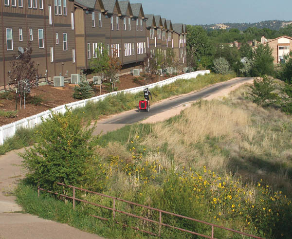 An eastbound cyclist rolls onto the new pavement in front of Creekview. 
Westside Pioneer photo