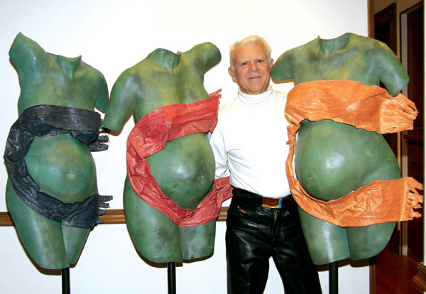 Keith Roberts stands with his body castings of a mother in
three stages of pregnancy. They will be on display for the
Nov. 10-11 Art Studio Tour at the gallery he shares with his wife, fine-jeweler Jane Roberts. 
Westside Pioneer photo
