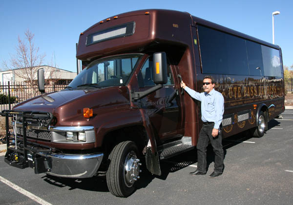 Jerry Lindemann, lead dispatcher for Mountain Metro
Transit, stands beside one of the new Ute Pass Express
buses, which have been designed to resemble the Midland trains that once clacked up the pass.
Westside Pioneer photo