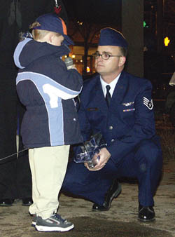 Dylan Gordon tells his father, Staff Sgt. Scott Gordon of Peterson Air Force Base, 
recently returned from Iraq, how glad he is that hes come home.
Westside Pioneer photo
