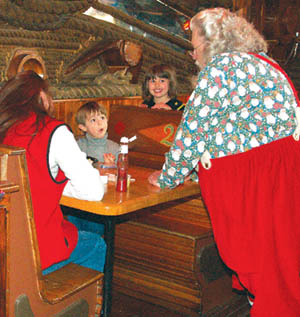 Santa Claus shares a moment with young diners Robbie 
Coco (left) and Alexa Tartaglini during the Breakfast with Santa at Meadow Muffins Dec. 11.
Westside Pioneer photo
