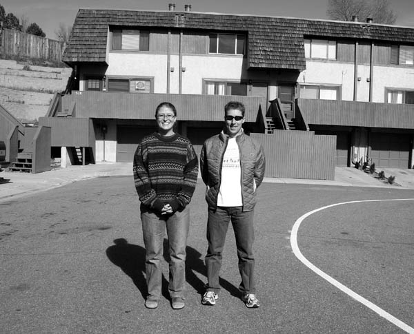 Panorama Estates Homeowners Association (HOA) President Angela Reali and Vice President Sean Kute stand
in front of one of the buildings in the 22-unit complex. Through the efforts of the HOA, all the buildings now sport
improved facades and a common exterior color, and other improvements are in the works. 
Westside Pioneer photo